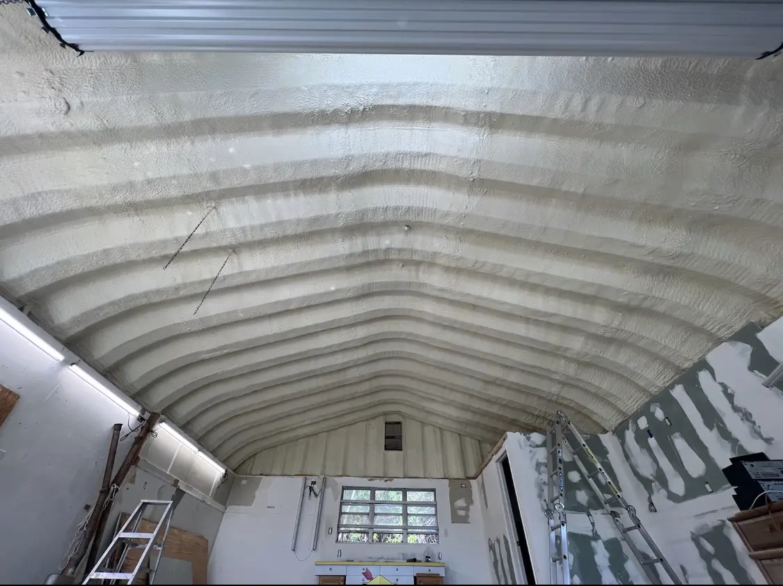 Spray polyurethane foam applied to the underside of a metal roof deck in Rumford
